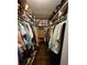 Walk-in closet featuring hardwood floors and shelving for clothes and accessories at 4094 Carlisle Pl, Stone Mountain, GA 30083