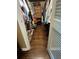 Walk-in closet featuring hardwood floors and shelving for clothes and accessories at 4094 Carlisle Pl, Stone Mountain, GA 30083