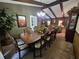 Elegant dining room with a large wooden table, comfortable chairs, and decorative accents at 4094 Carlisle Pl, Stone Mountain, GA 30083