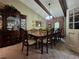 Formal dining room features a beamed ceiling, neutral walls, and ornate hutch for displaying fine china at 4094 Carlisle Pl, Stone Mountain, GA 30083