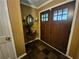 Foyer featuring double doors, decorative table with mirror, slate flooring, and neutral wall colors at 4094 Carlisle Pl, Stone Mountain, GA 30083