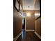 Image shows a hallway with hardwood floors and neutral paint at 4094 Carlisle Pl, Stone Mountain, GA 30083