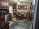 Eat-in kitchen with wood cabinets, breakfast nook, and stainless steel dishwasher providing modern convenience at 4094 Carlisle Pl, Stone Mountain, GA 30083