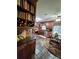 Charming kitchen with wood cabinets, stone floors, and stainless steel appliances, adjacent to a breakfast nook at 4094 Carlisle Pl, Stone Mountain, GA 30083