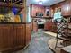 Cozy kitchen featuring stone floors, wood cabinets, and stainless steel appliances, providing a warm culinary space at 4094 Carlisle Pl, Stone Mountain, GA 30083