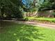 Beautiful flower bed with colorful flowers, fresh mulch, and a well-manicured lawn at 4094 Carlisle Pl, Stone Mountain, GA 30083