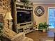 Cozy living room with hardwood floors, a decorative clock, and access to the patio through sliding glass doors at 4094 Carlisle Pl, Stone Mountain, GA 30083