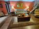 Open-concept living room with hardwood floors, comfortable seating, and easy access to the upper level at 4094 Carlisle Pl, Stone Mountain, GA 30083