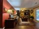 Spacious living room with hardwood floors, comfortable seating, and access to the outdoor patio at 4094 Carlisle Pl, Stone Mountain, GA 30083