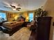 Spacious bedroom with ceiling fan, lamps, art and comfortable furniture at 4094 Carlisle Pl, Stone Mountain, GA 30083