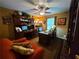 Home office features a desk, computer, sofa, ceiling fan, and hardwood floors at 4094 Carlisle Pl, Stone Mountain, GA 30083
