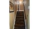 Image shows a staircase with dark wood steps and trim at 4094 Carlisle Pl, Stone Mountain, GA 30083