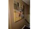 Close up of wall art on the stairwell landing with dark wood trim at 4094 Carlisle Pl, Stone Mountain, GA 30083