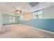Finished basement with carpet flooring, natural light, and accent wall; great for entertaining at 113 Hitchcock Dr, Villa Rica, GA 30180