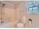 Bright bathroom featuring a shower-tub combo and decorative accents for a cozy feel at 113 Hitchcock Dr, Villa Rica, GA 30180
