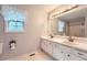 Bathroom featuring double sinks, a large mirror, and good lighting at 113 Hitchcock Dr, Villa Rica, GA 30180