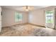 Large bedroom with plush carpet, neutral walls, and ample natural light at 113 Hitchcock Dr, Villa Rica, GA 30180