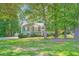 Inviting two-story home with lush landscaping and charming curb appeal at 113 Hitchcock Dr, Villa Rica, GA 30180