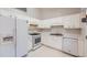 Bright kitchen with white cabinets, appliances, and clean countertops at 113 Hitchcock Dr, Villa Rica, GA 30180