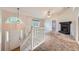 Bright living room featuring a fireplace, large window, and staircase at 113 Hitchcock Dr, Villa Rica, GA 30180
