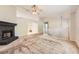 Spacious living room featuring a fireplace, plush carpet, and ample natural light at 113 Hitchcock Dr, Villa Rica, GA 30180