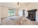 Comfortable living room with a stone fireplace and vaulted ceilings at 113 Hitchcock Dr, Villa Rica, GA 30180