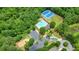Aerial view of community pool, playground and tennis courts offers residents recreational opportunities and social gatherings at 4003 Coachman Ct, Cumming, GA 30040
