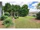 Well-maintained backyard with lush landscaping, patio, and ample green space for outdoor enjoyment at 4003 Coachman Ct, Cumming, GA 30040
