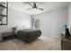 Cozy bedroom with a neutral color scheme, simple decor, and a ceiling fan for added comfort at 4003 Coachman Ct, Cumming, GA 30040