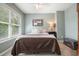 Comfortable bedroom with soft natural light, neutral tones, and cozy carpet flooring for a relaxing ambiance at 4003 Coachman Ct, Cumming, GA 30040