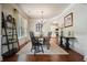 Elegant dining room with hardwood flooring, chandelier, and view into kitchen at 4003 Coachman Ct, Cumming, GA 30040
