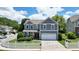 Charming two-story home with a well-manicured lawn and white picket fence at 4003 Coachman Ct, Cumming, GA 30040