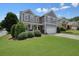 Well-maintained two-story home with lush landscaping and a two-car garage at 4003 Coachman Ct, Cumming, GA 30040
