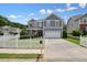 Attractive two-story house boasts a well-kept lawn and a charming white fence at 4003 Coachman Ct, Cumming, GA 30040
