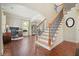 Beautiful foyer with hardwood floors and staircase with natural light at 4003 Coachman Ct, Cumming, GA 30040