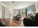Cozy living room with hardwood floors, a fireplace, and an open layout at 4003 Coachman Ct, Cumming, GA 30040