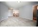 Bright living room with gray carpet, light-gray walls, and natural lighting at 4003 Coachman Ct, Cumming, GA 30040