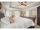 Main bedroom with great natural lighting, a ceiling fan, and access to other rooms at 4003 Coachman Ct, Cumming, GA 30040