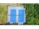Overhead view of tennis courts in a neighborhood offering a recreational amenity for residents surrounded by lush greenery at 4003 Coachman Ct, Cumming, GA 30040