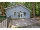 Community building featuring a light blue exterior, glass doors, and well-maintained landscaping at 4081 Riverlook Se Pkwy # 13, Marietta, GA 30067
