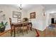 Elegant dining area showcasing classic furniture and decor with a view of kitchen at 4081 Riverlook Se Pkwy # 13, Marietta, GA 30067