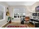 Well-lit home office with two windows, and contemporary desk setup, ideal for productivity at 4081 Riverlook Se Pkwy # 13, Marietta, GA 30067