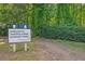Sign indicating the entrance to national forest and jogging trails, surrounded by greenery at 4081 Riverlook Se Pkwy # 13, Marietta, GA 30067