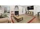 Bright living room features a fireplace, modern decor and leads to the front door at 4081 Riverlook Se Pkwy # 13, Marietta, GA 30067