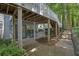 Exterior patio beneath a deck, with seating and access to a staircase and walking path at 4081 Riverlook Se Pkwy # 13, Marietta, GA 30067