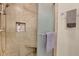 Neutral bathroom with a tiled shower, bench, and sleek glass door, offering a spa-like experience at 4081 Riverlook Se Pkwy # 13, Marietta, GA 30067