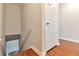 Basement access featuring finished stairs and white painted doors at 440 Forestgate Ct, Atlanta, GA 30350