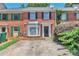 Charming brick townhome with a well-maintained front yard and covered entryway at 440 Forestgate Ct, Atlanta, GA 30350