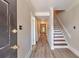 Inviting entryway with wood-look floors leads to a staircase and other rooms at 440 Forestgate Ct, Atlanta, GA 30350