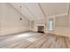 Bright living room with vaulted ceilings, modern flooring, and a fireplace at 440 Forestgate Ct, Atlanta, GA 30350